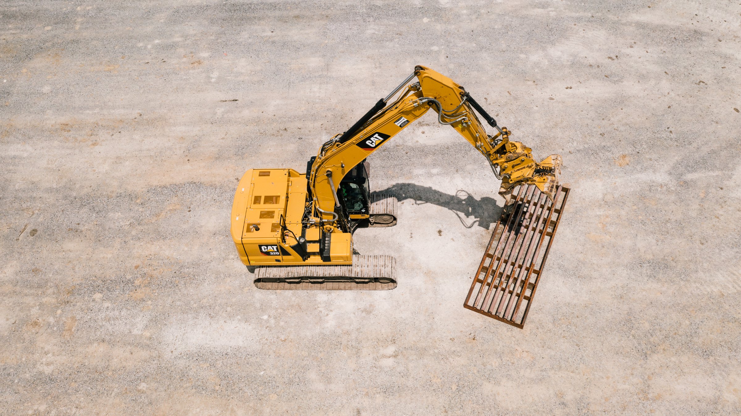 Excavator on a Diamond D site, from above